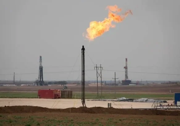 A gas flare is seen from the air.